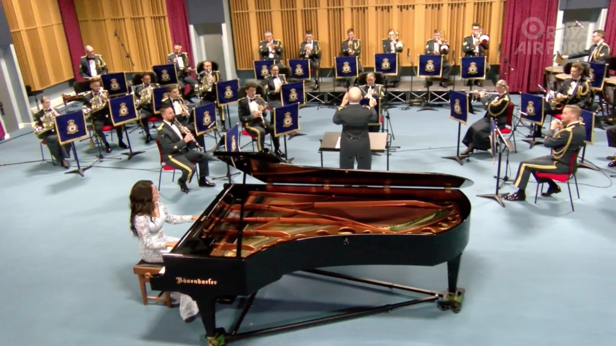 Ify playing the piano with the RAF Musicians.